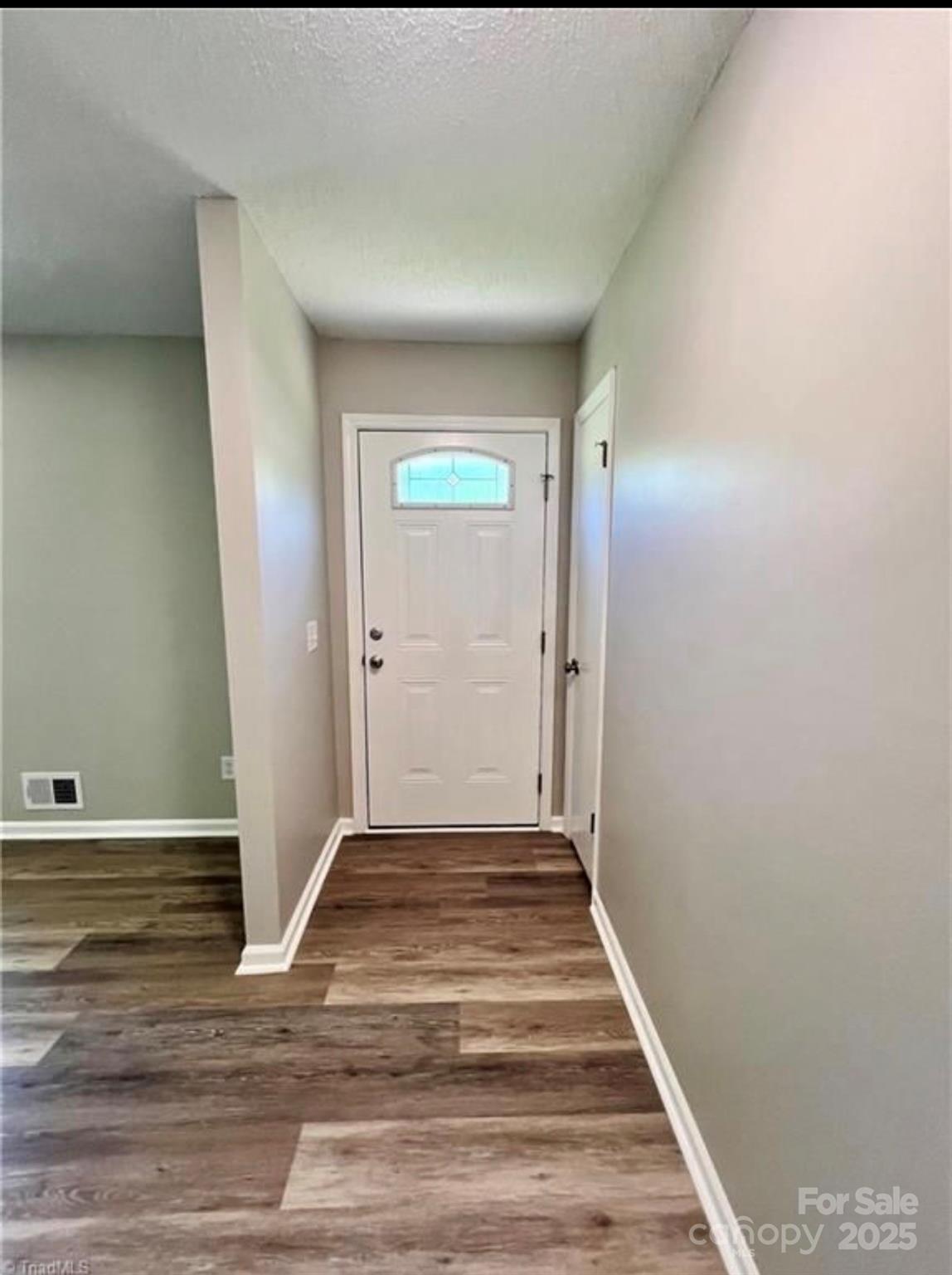 276 Country Club Road Wilkesboro, NC 28697 - Photo 7 of 16 a view of a hallway with wooden floor