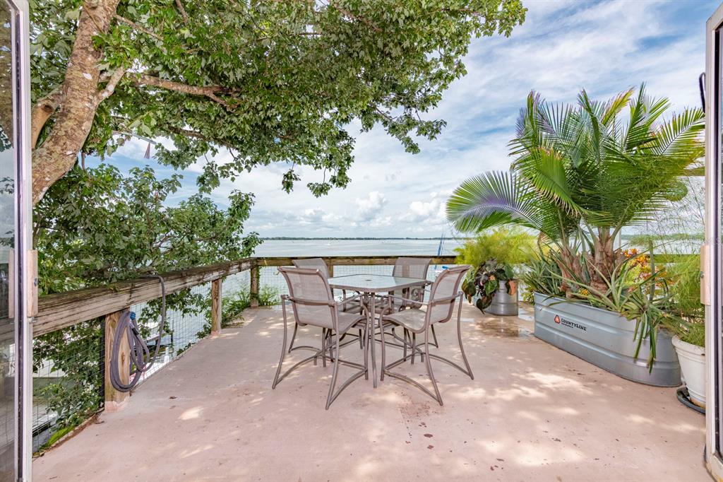 408 Lake Dora Road, Unit A Mount Dora, FL 32757 - Photo 1 of 1 a view of a patio with a table and chairs