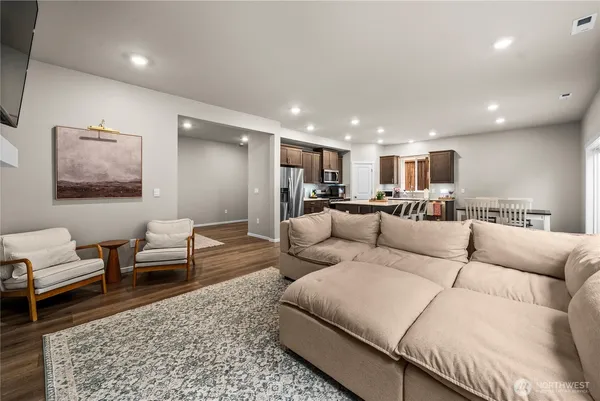 a living room with furniture and a rug