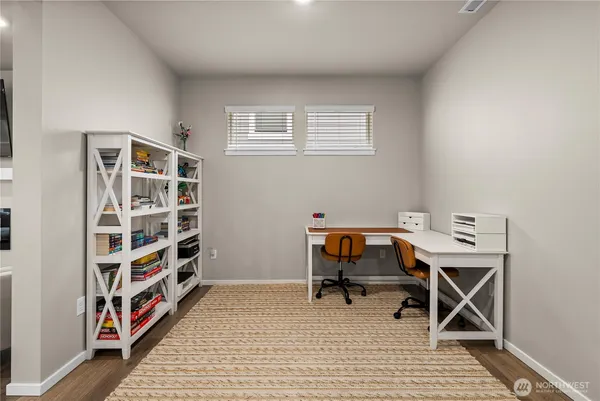 a view of a workspace with furniture and toys