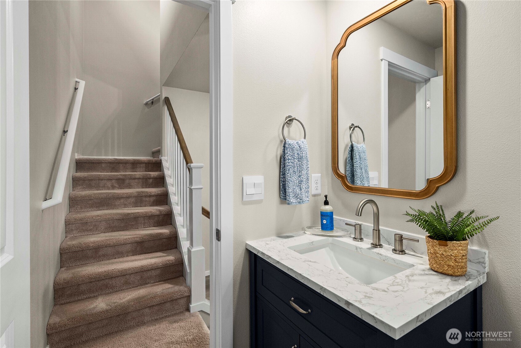 1081 Southwest Pendleton Way Port Orchard, WA 98367 - Photo 15 of 40 a bathroom with a sink and a mirror