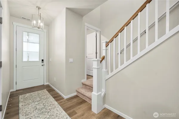 wooden floor with an entryway