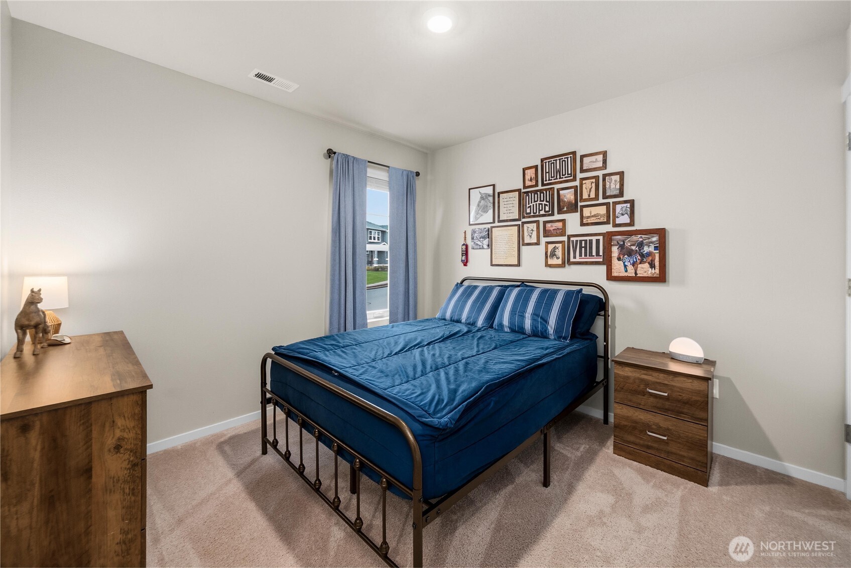 1081 Southwest Pendleton Way Port Orchard, WA 98367 - Photo 27 of 40 a bedroom with a bed and a dresser