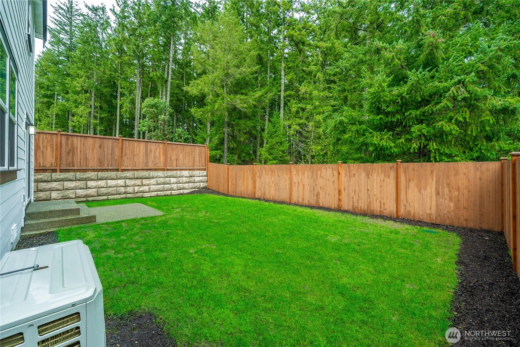 1081 Southwest Pendleton Way Port Orchard, WA 98367 - Photo 31 of 40 a view of a backyard with a small cabin and wooden fence