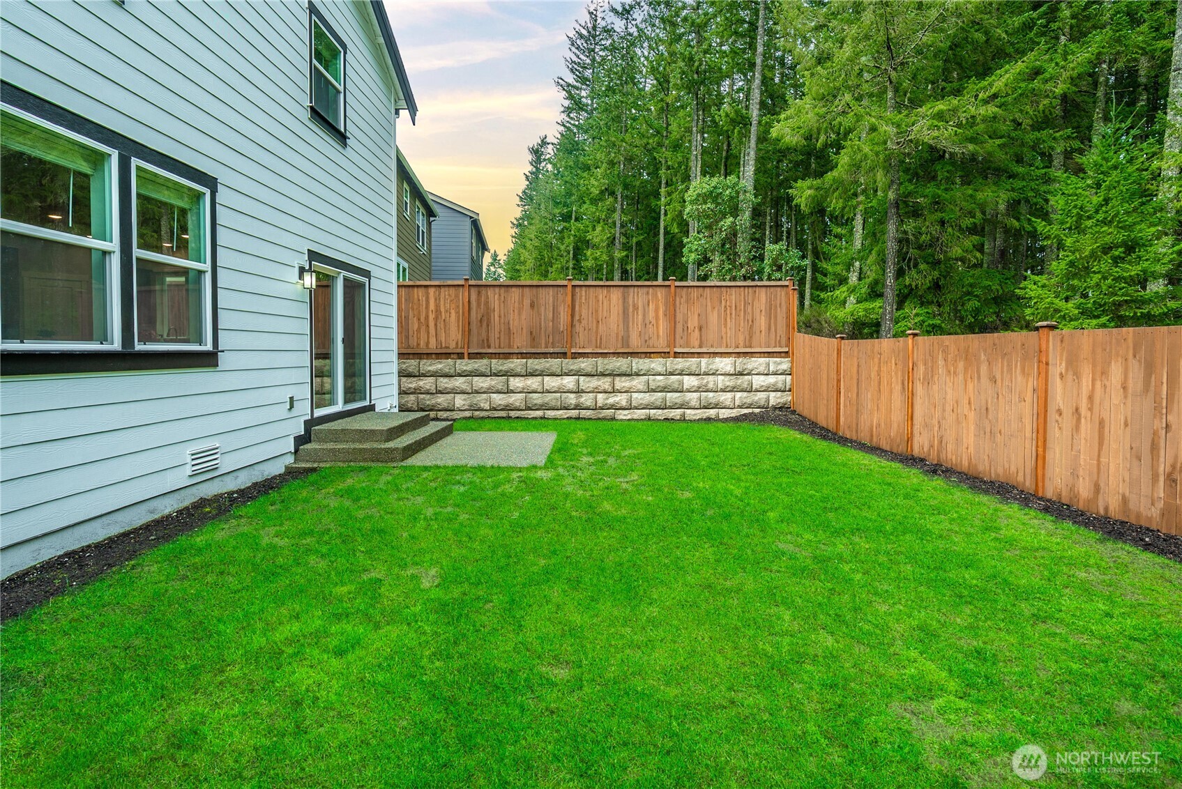 1081 Southwest Pendleton Way Port Orchard, WA 98367 - Photo 32 of 40 a view of a backyard with a small cabin and wooden fence