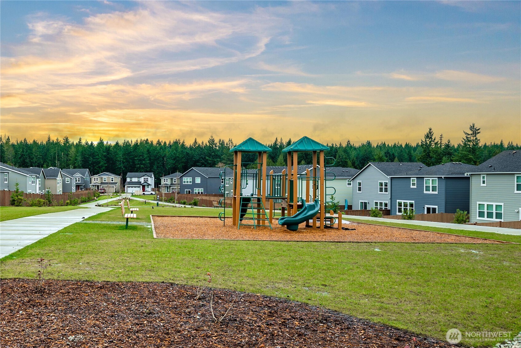 1081 Southwest Pendleton Way Port Orchard, WA 98367 - Photo 39 of 40 a view of a swimming pool with lawn chairs and large trees