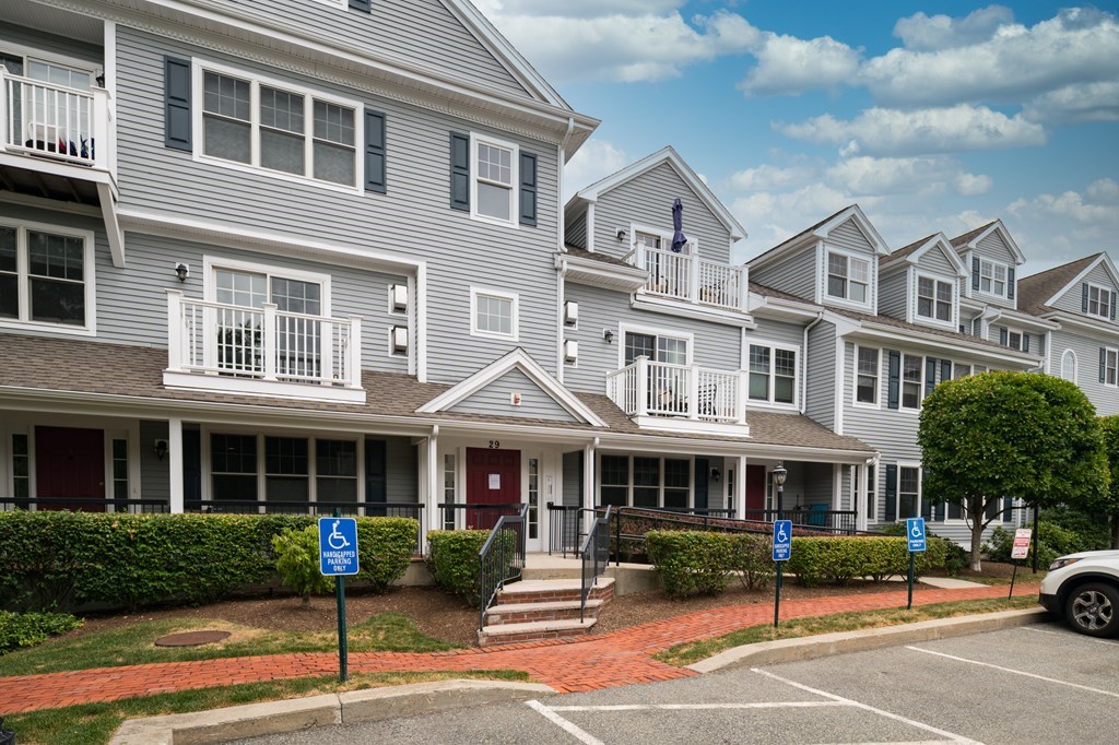 29 Maple Street, Unit E Canton, MA 02021 - Photo 3 of 23 a front view of a building with garden