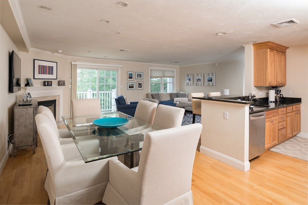 29 Maple Street, Unit E Canton, MA 02021 - Photo 5 of 23 a dining room with furniture a window and kitchen view
