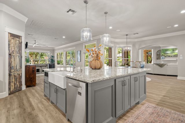 a living room with furniture a wooden floor and window