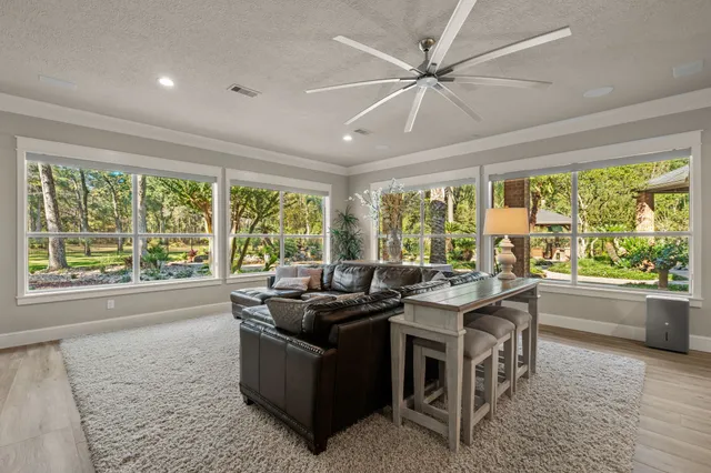 a view of a double vanity sink and a window