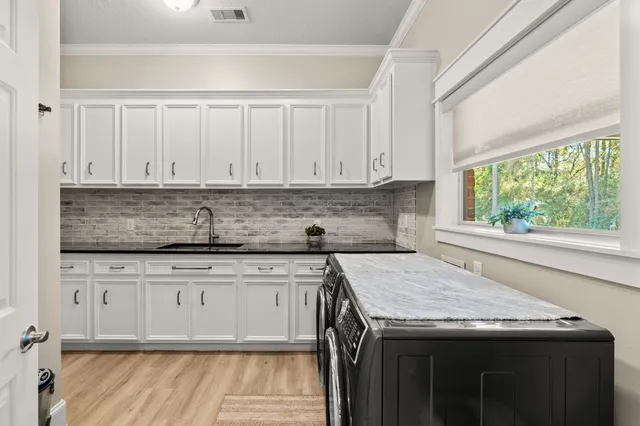 a view of swimming pool and trees in the background