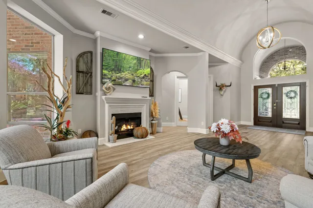 a kitchen with stainless steel appliances granite countertop cabinets a stove a sink a center island and a window