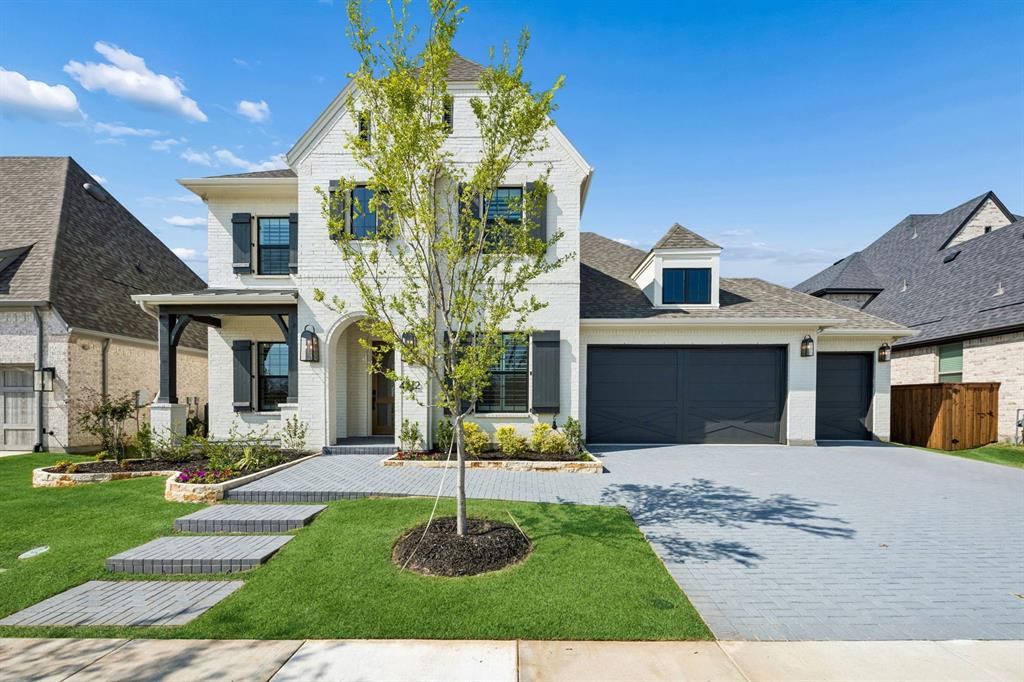 4512 Meander Way Prosper, TX 75078 - Photo 1 of 39 a front view of a house with a yard