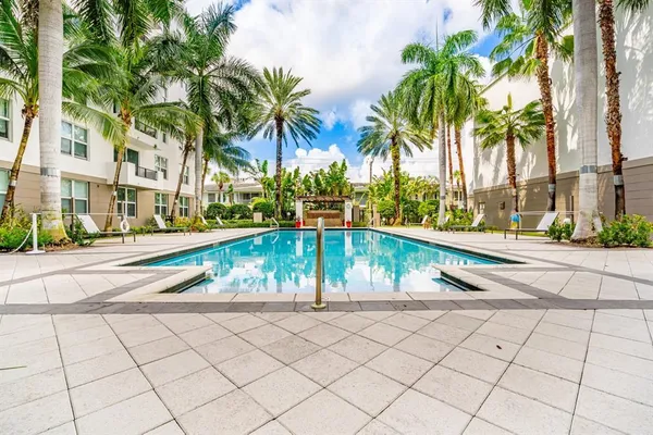 a view of a patio with table and chairs potted plants with wooden fence