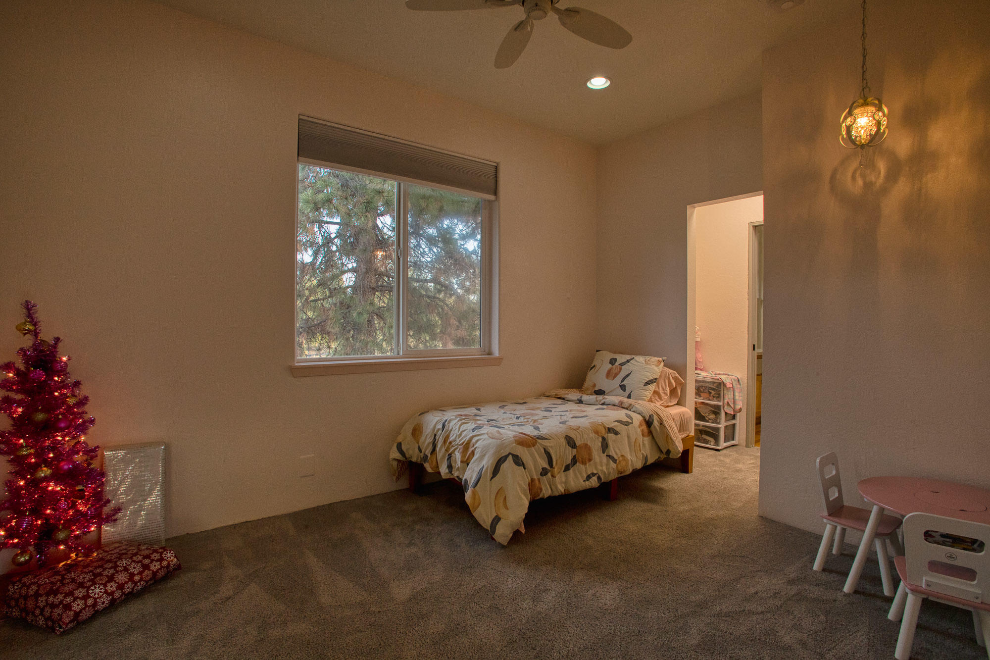 19490 Calico Road Bend, OR 97702 - Photo 12 of 67 a bed sitting in a bedroom next to a window