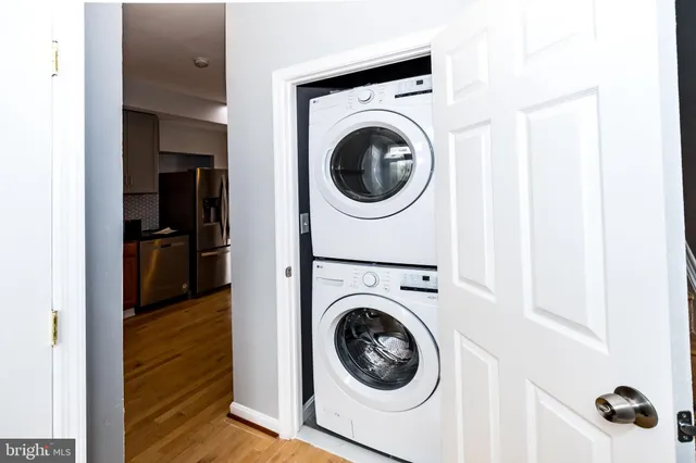 a view of a hallway with washer and dryer