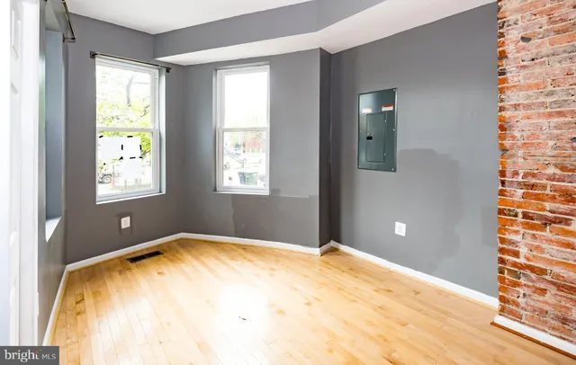 a view of empty room with windows
