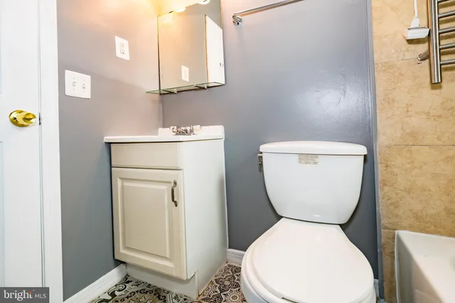 a bathroom with a toilet and a sink