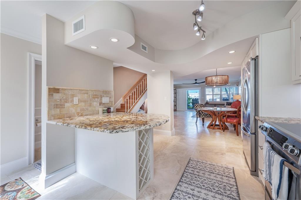 800 River Point Drive, Unit 207 Naples, FL 34102 - Photo 18 of 47 a view of a living room and a wooden floor