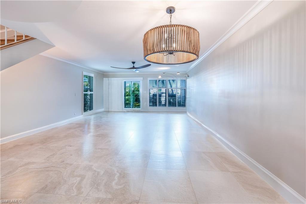 800 River Point Drive, Unit 207 Naples, FL 34102 - Photo 19 of 47 wooden floor in an empty room with a window