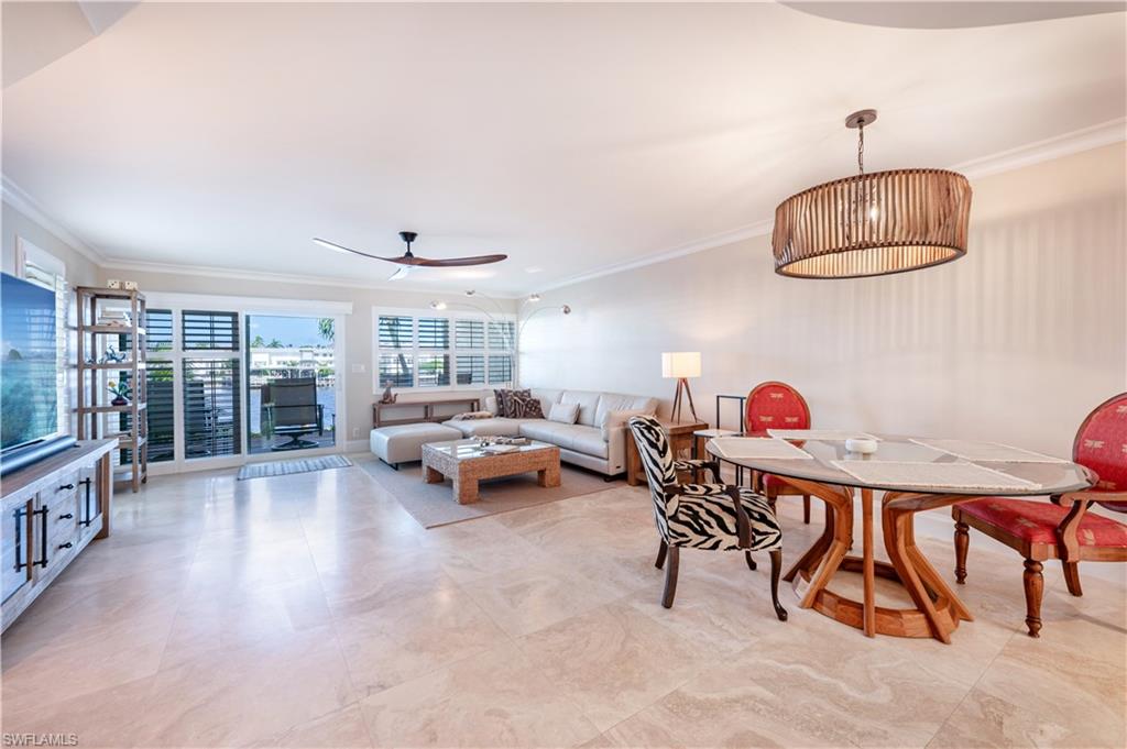 800 River Point Drive, Unit 207 Naples, FL 34102 - Photo 21 of 47 a bedroom with furniture and a window