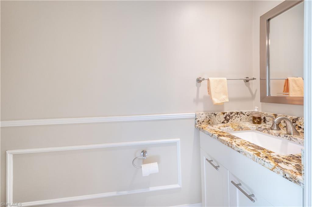 800 River Point Drive, Unit 207 Naples, FL 34102 - Photo 24 of 47 a bathroom with a sink and a vanity