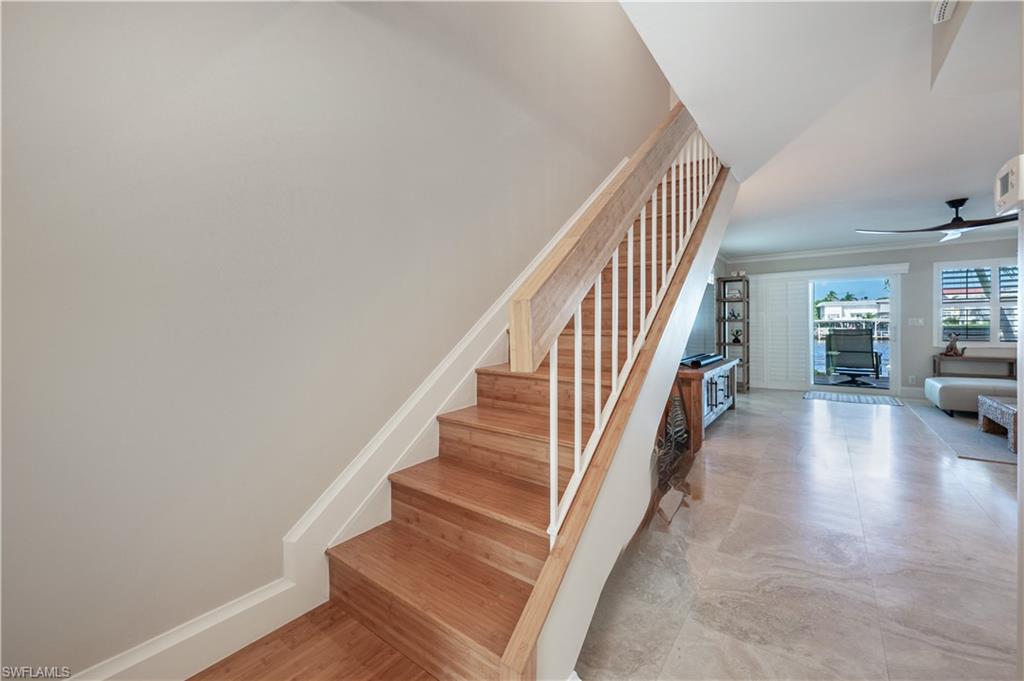800 River Point Drive, Unit 207 Naples, FL 34102 - Photo 25 of 47 a view of entryway and hall with wooden floor