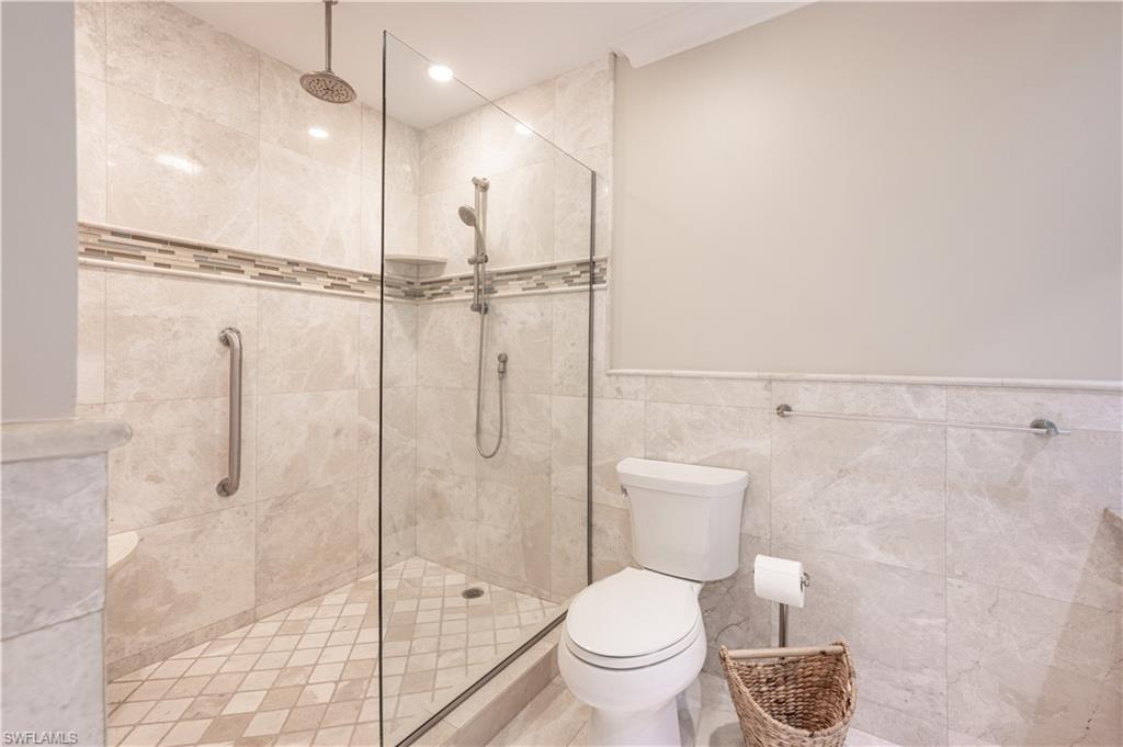800 River Point Drive, Unit 207 Naples, FL 34102 - Photo 35 of 47 a bathroom with a toilet and a shower