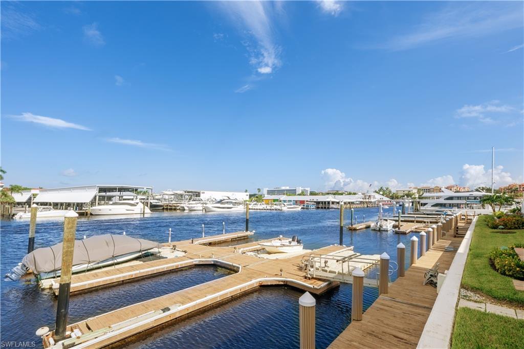 800 River Point Drive, Unit 207 Naples, FL 34102 - Photo 4 of 47 a view of a terrace with outdoor seating and city view