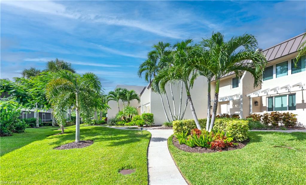 800 River Point Drive, Unit 207 Naples, FL 34102 - Photo 42 of 47 a garden with palm trees