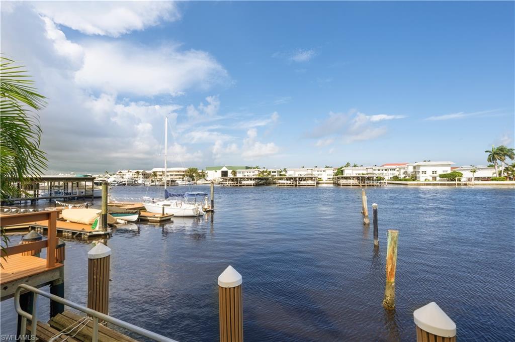 800 River Point Drive, Unit 207 Naples, FL 34102 - Photo 47 of 47 a view of a terrace with lawn chairs