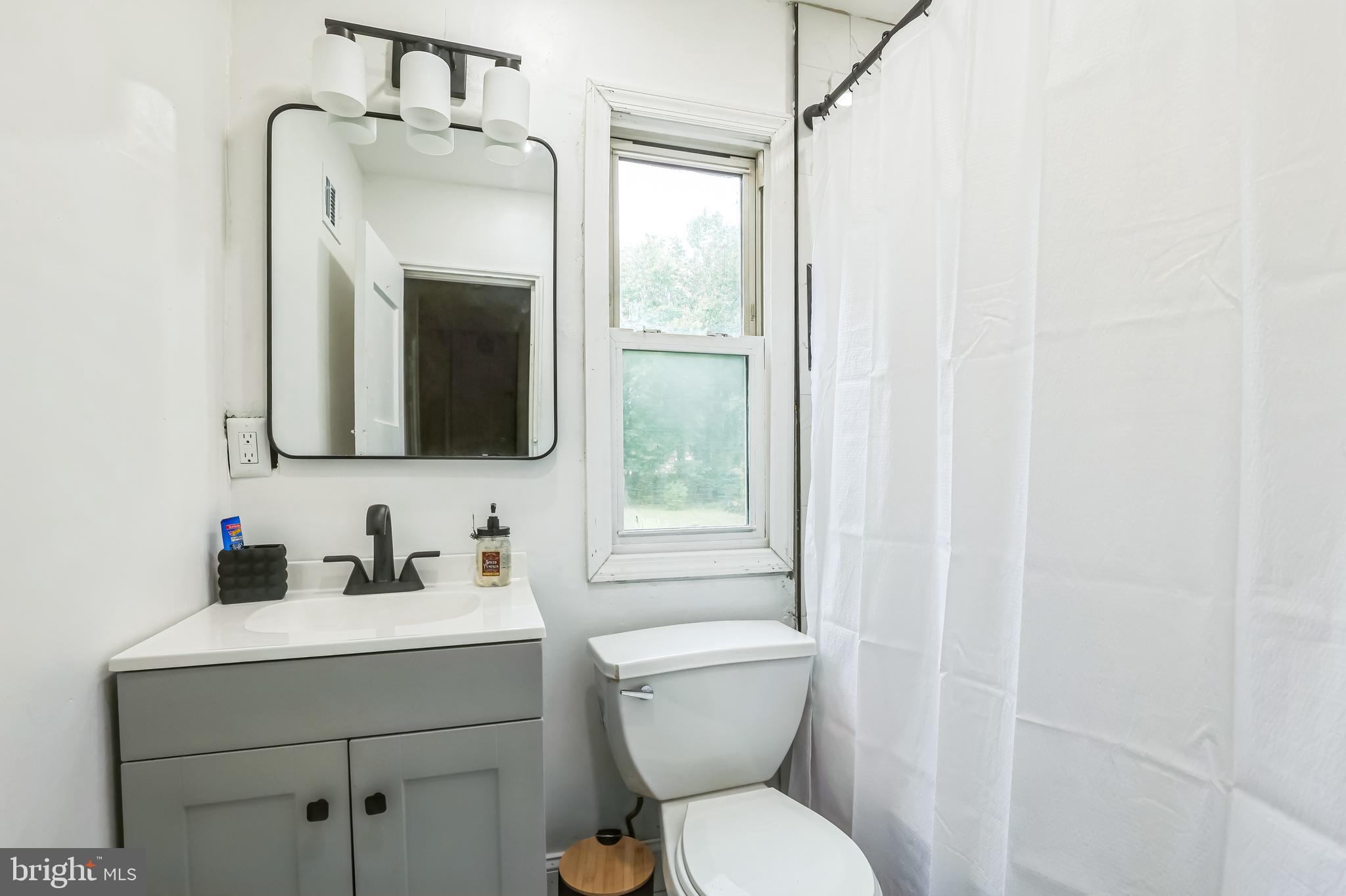 1510 Daws Road Blue Bell, PA 19422 - Photo 19 of 25 a bathroom with a toilet sink and mirror