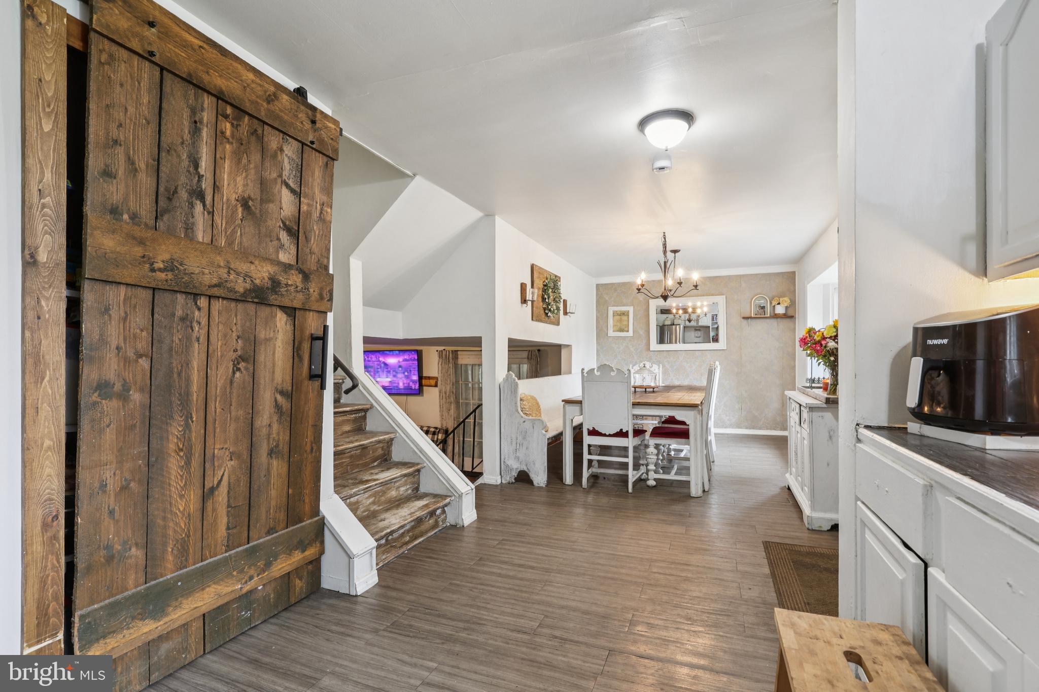 1510 Daws Road Blue Bell, PA 19422 - Photo 6 of 25 a view of a livingroom with furniture wooden floor staircase and windows