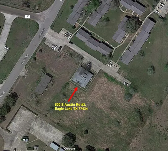 an aerial view of a red and white house