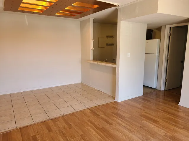a view of a livingroom with wooden floor