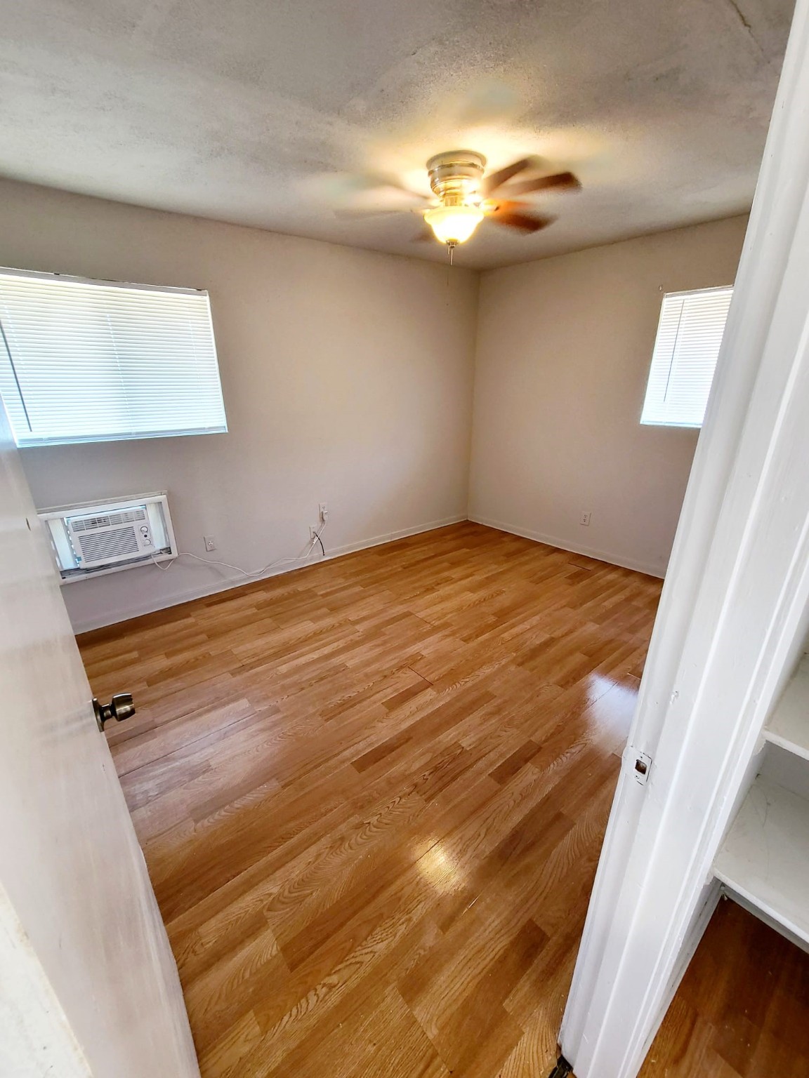 500 Austin Road, Unit 3 Eagle Lake, TX 77434 - Photo 8 of 11 a view of empty room with wooden floor