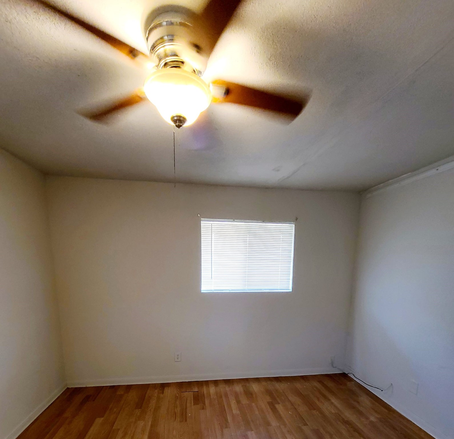 500 Austin Road, Unit 3 Eagle Lake, TX 77434 - Photo 9 of 11 a view of a ceiling fan and a window