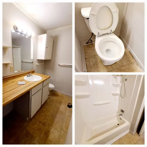 a bathroom with a sink mirror vanity and toilet