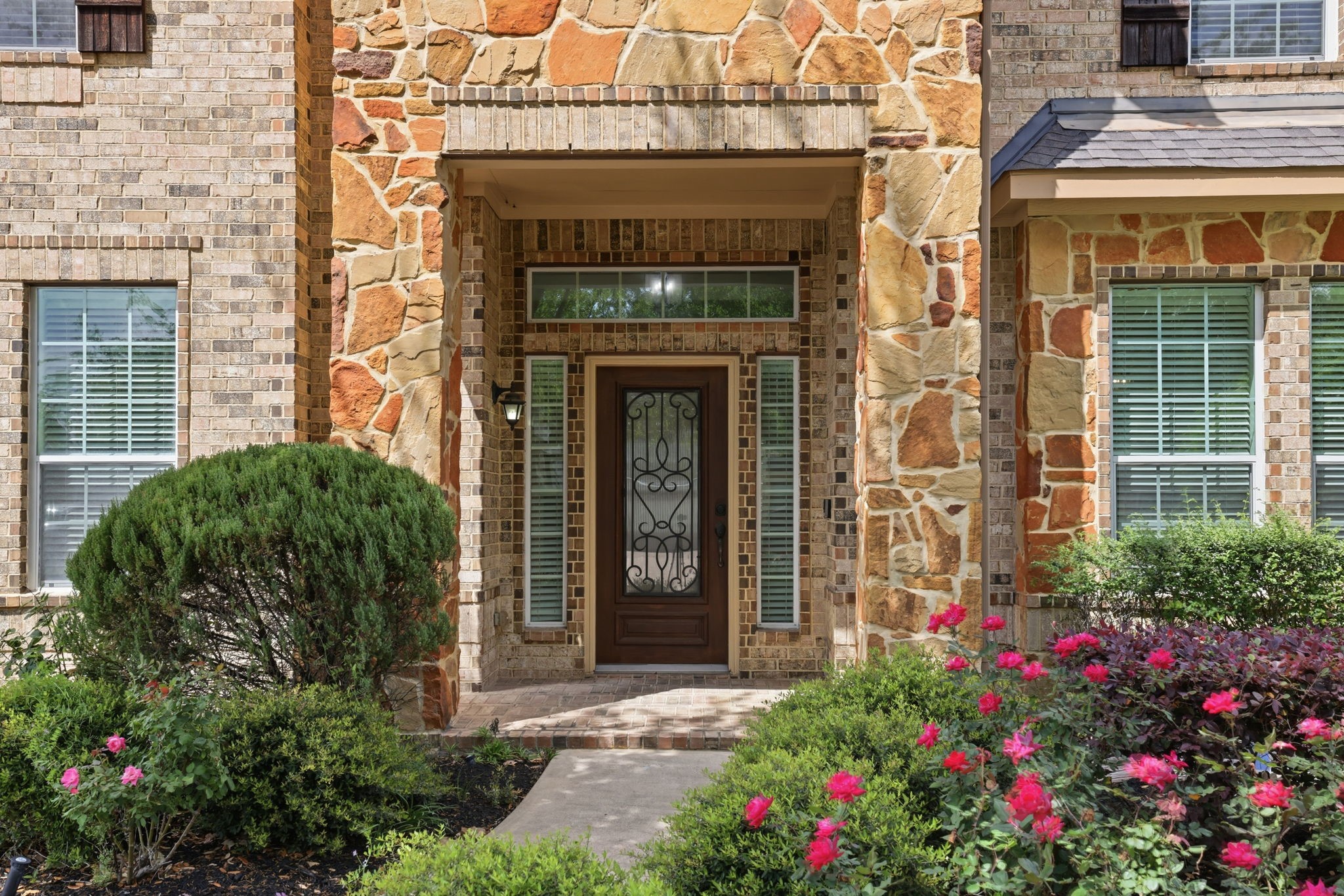 8169 Tranquil Lake Way Conroe, TX 77385 - Photo 3 of 26 a view of a house with potted plants