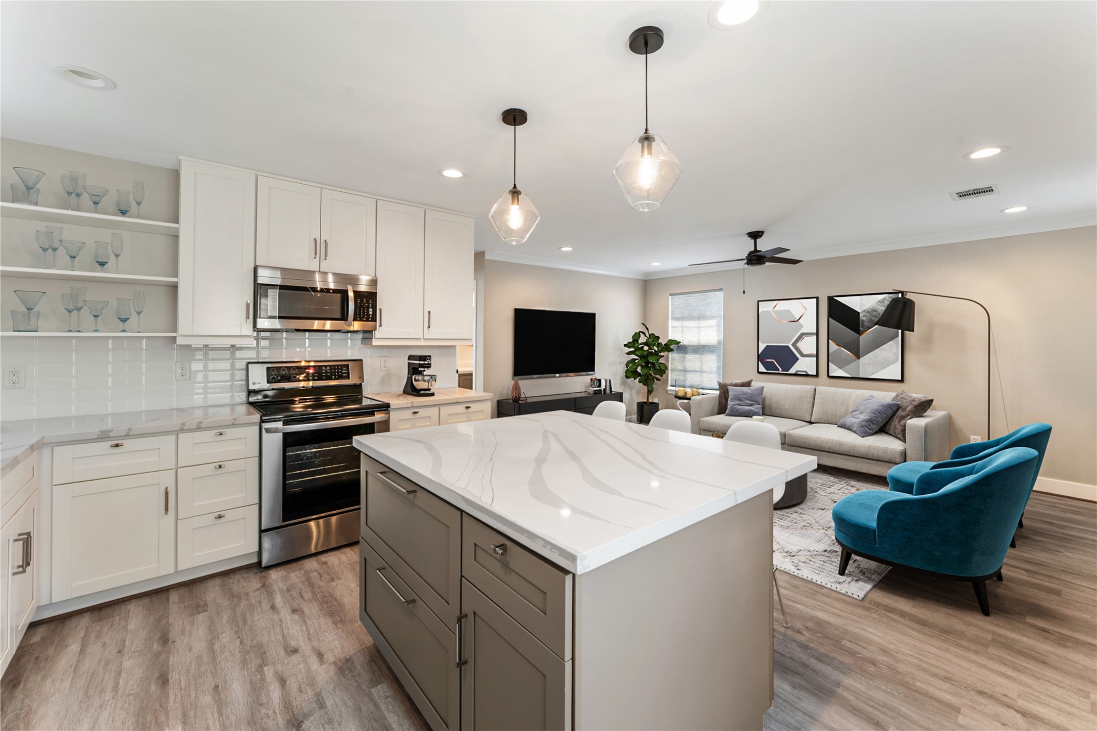 809 East 40th Street Houston, TX 77022 - Photo 11 of 27 Open-concept living connects the updated kitchen to a spacious living area, enhanced by new flooring and updated lighting throughout. Perfect for entertaining or everyday living with a clean, modern feel. virtually staged