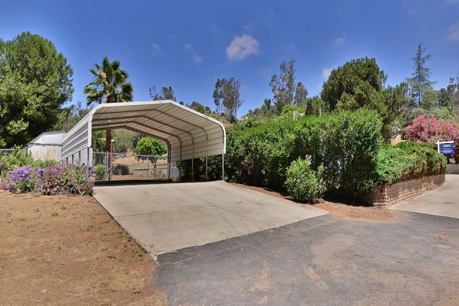 11319 Posthill Road Lakeside, CA 92040 - Photo 2 of 25 Additional carport area to left of home.