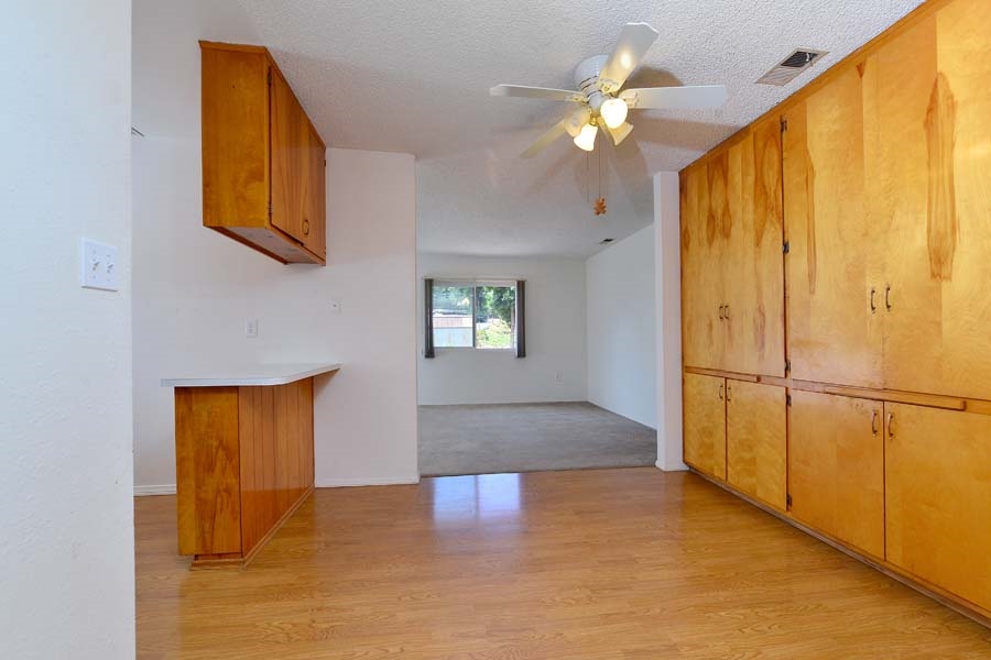 11319 Posthill Road Lakeside, CA 92040 - Photo 5 of 25 Large dining area just of the kitchen with lots of cabinetry for all your storage needs.