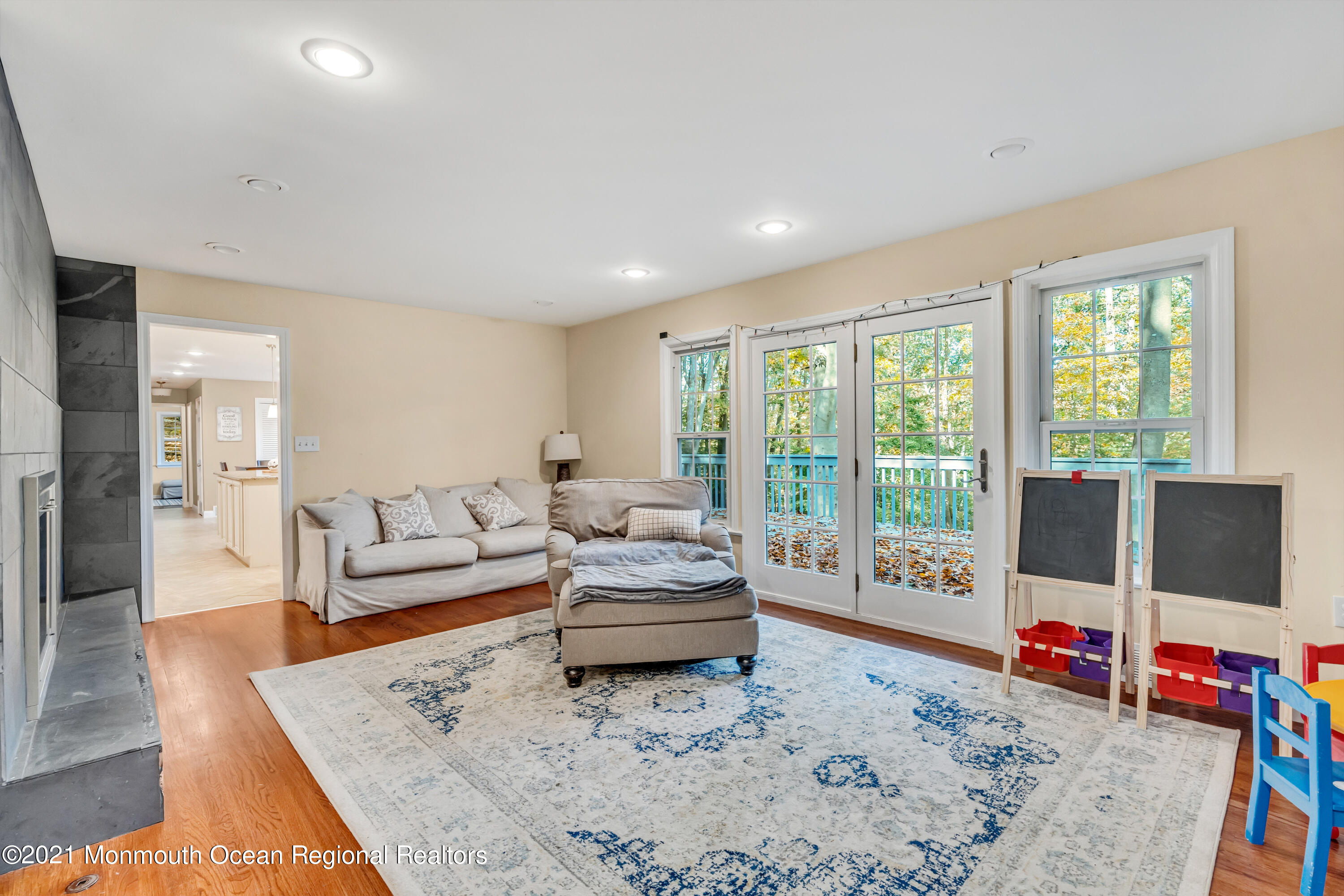 36 Glenwood Road Colts Neck, NJ 07722 - Photo 3 of 23 a living room with furniture and a flat screen tv