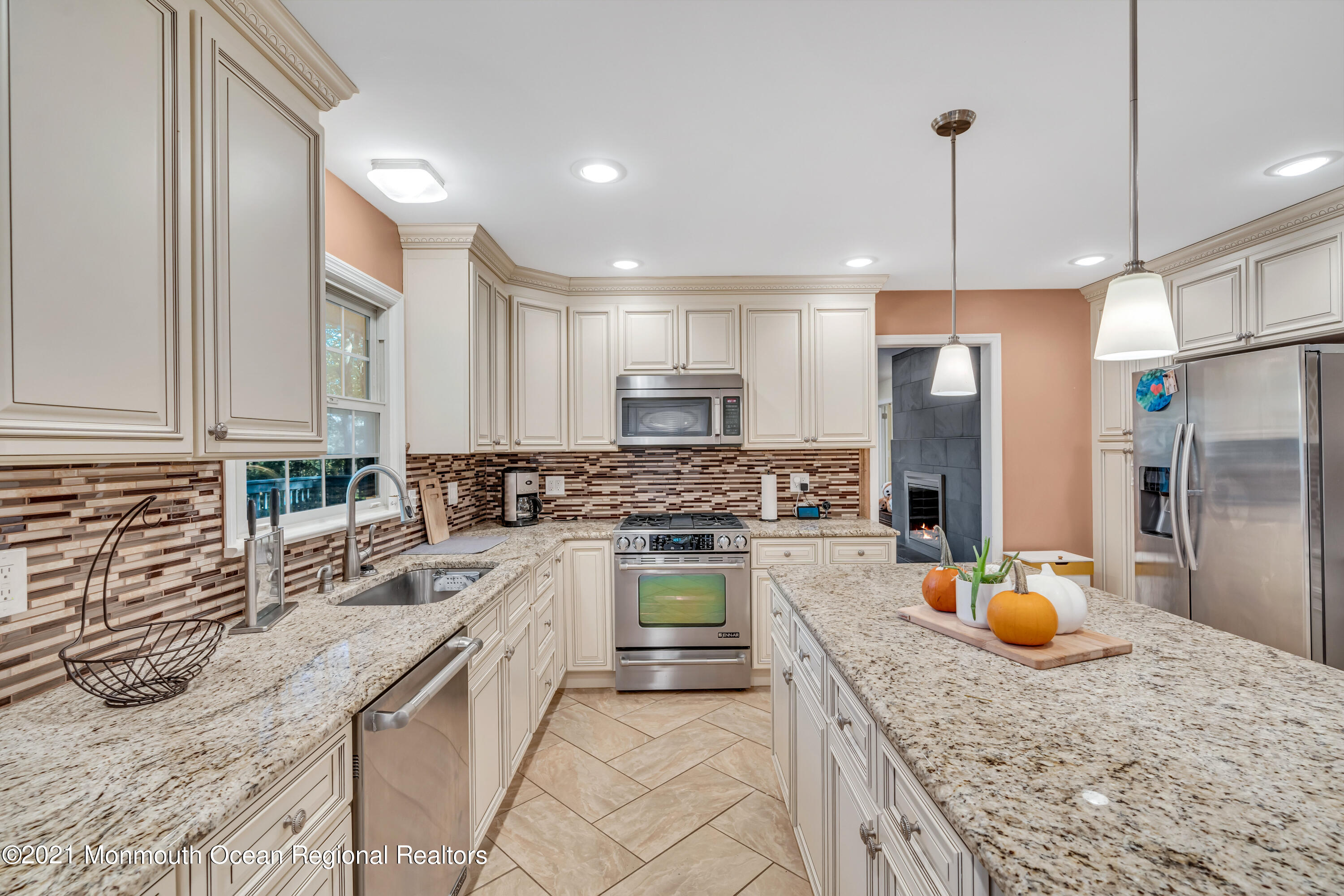 36 Glenwood Road Colts Neck, NJ 07722 - Photo 8 of 23 a kitchen with stainless steel appliances granite countertop a sink a stove and a refrigerator