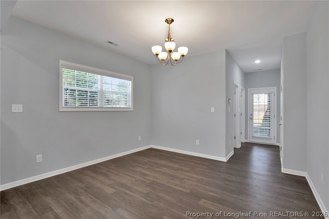 258 Fieldbrook Street Raeford, NC 28376 - Photo 15 of 40 wooden floor in an empty room with a window