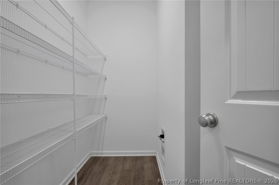 258 Fieldbrook Street Raeford, NC 28376 - Photo 16 of 40 a view of storage and utility room with racks on the wall
