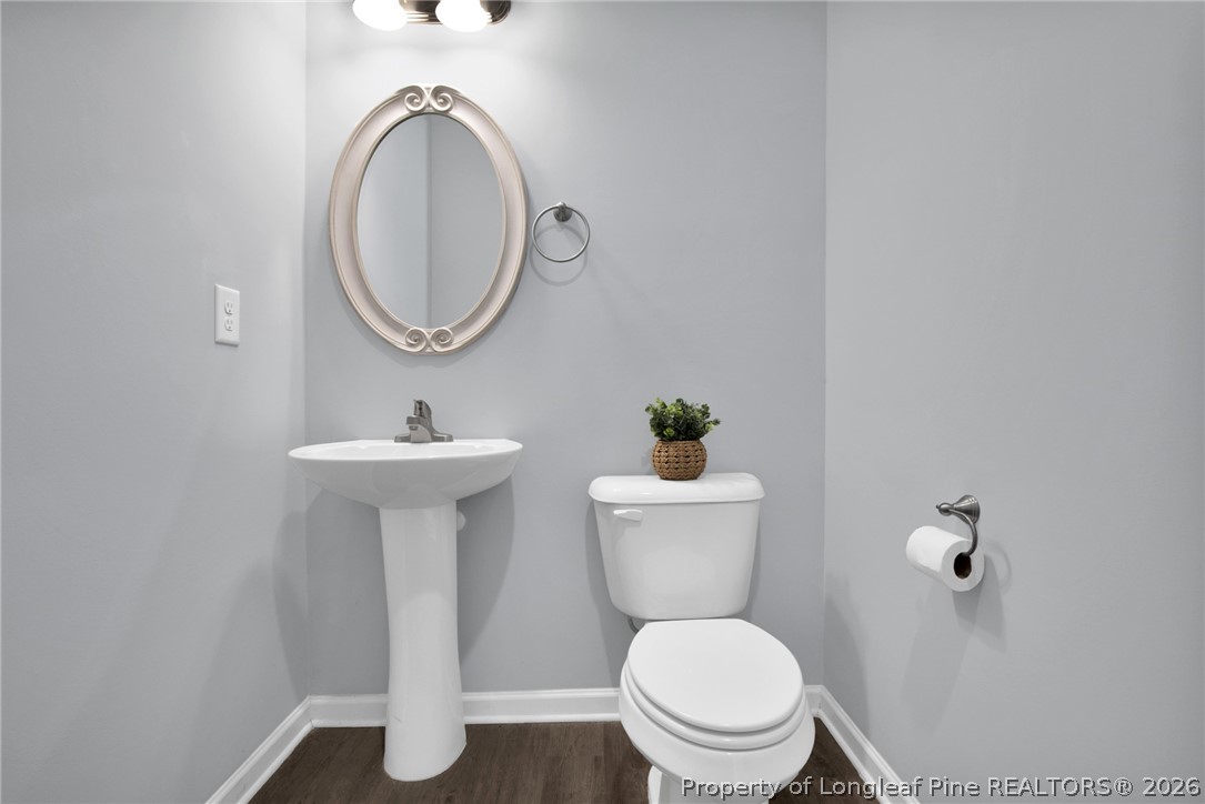 258 Fieldbrook Street Raeford, NC 28376 - Photo 17 of 40 a bathroom with a toilet sink and mirror