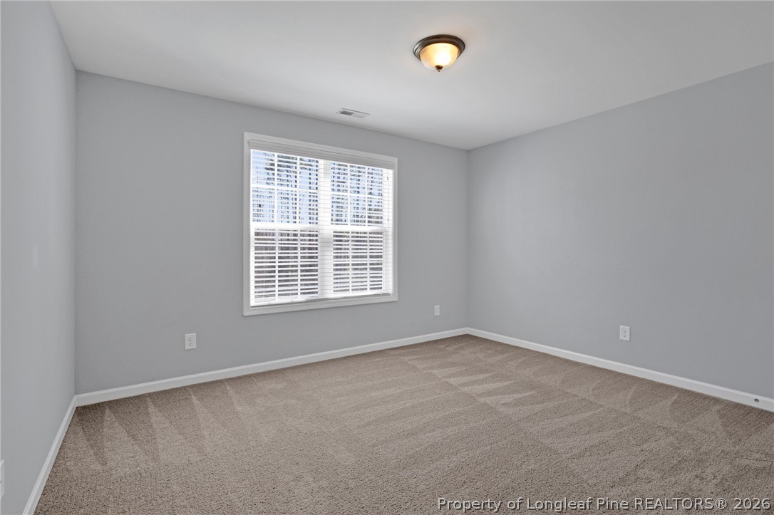 258 Fieldbrook Street Raeford, NC 28376 - Photo 19 of 40 an empty room with a empty space and a window