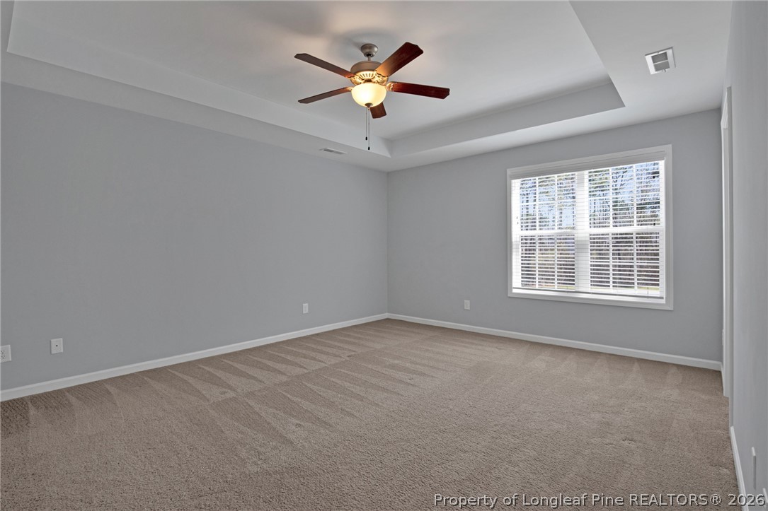 258 Fieldbrook Street Raeford, NC 28376 - Photo 27 of 40 an empty room with ceiling fan and windows