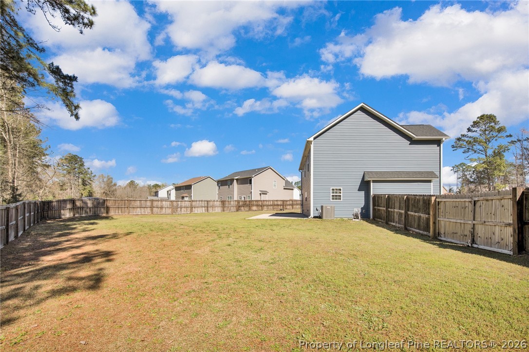 258 Fieldbrook Street Raeford, NC 28376 - Photo 40 of 40 a view of a large house with a big yard and large tree